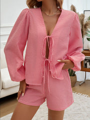 Strawberry gingham tie-front blouse with puff sleeves and matching shorts.
