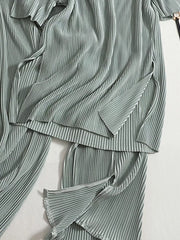 Elegant olive pleated two-piece set with side slits on top and pants.