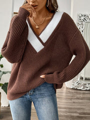 Chocolate knit sweater with white contrast trim V-neck and long sleeves.