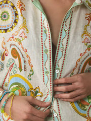 Bohemian print button-up shirt with colorful graphic patterns and text details.