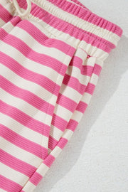 Pink stripe lounge set with drawstring waist and pockets.