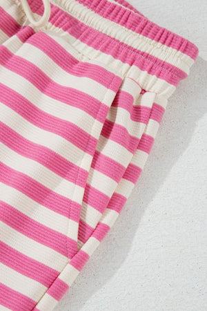 Pink stripe lounge set with drawstring waist and pockets.