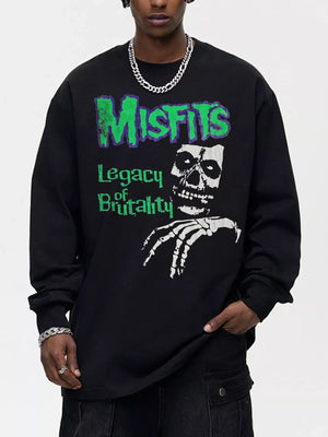Black oversized long-sleeve sweatshirt with Misfits Legacy of Brutality skull graphic.