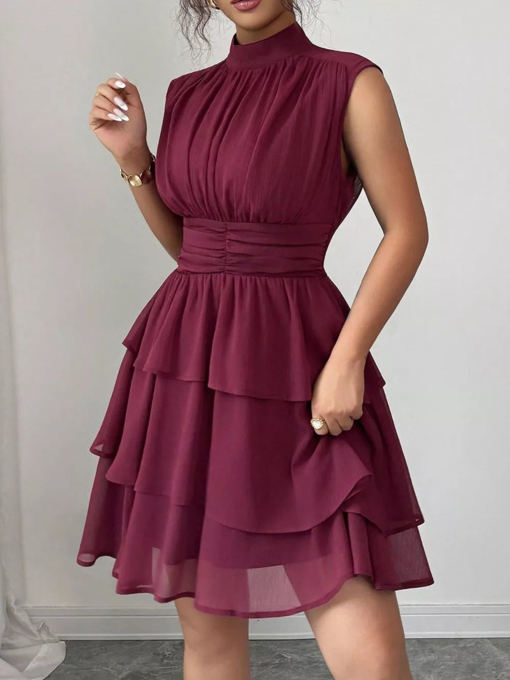 Dark Red sleeveless ruffle tiered dress with ruched bodice and cinched waist.