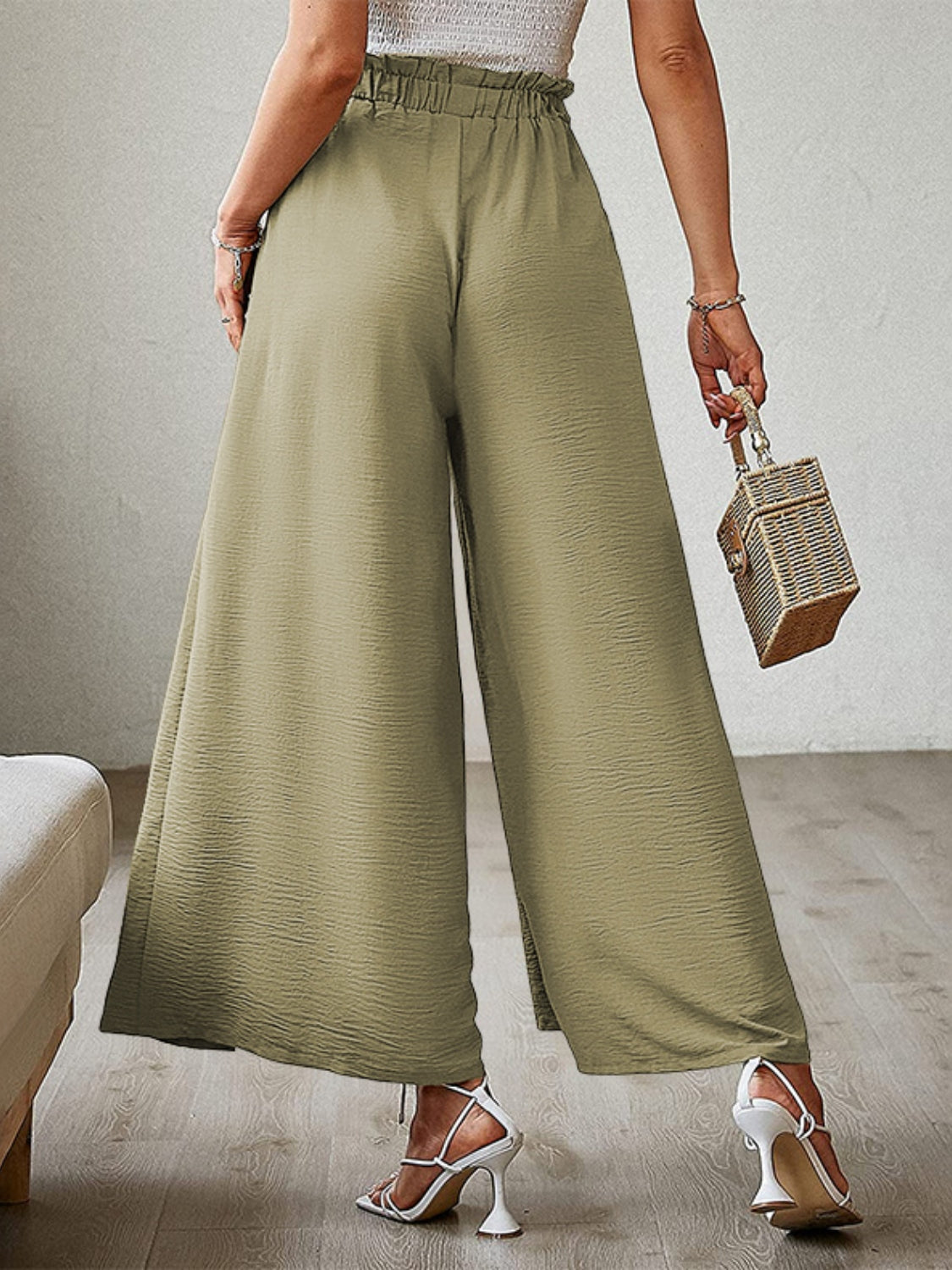 Paperbag waist palazzo pants in Matcha Green with side slits and a textured finish.
