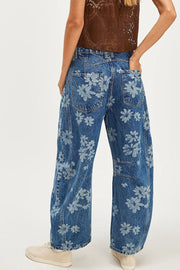 Floral print balloon jeans in medium wash denim with a relaxed fit.