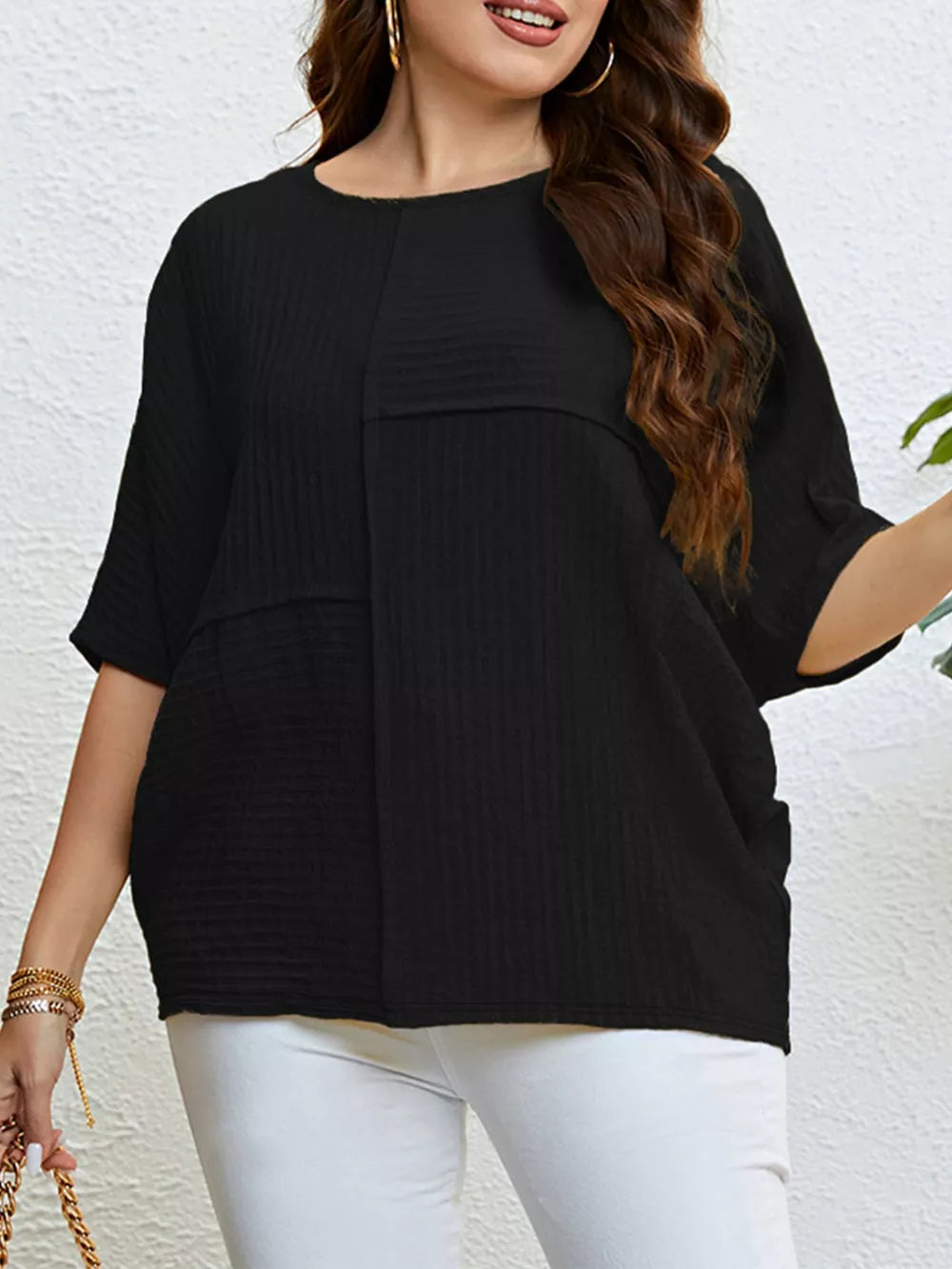 Black textured relaxed-fit t-shirt with short sleeves and a crew neck.