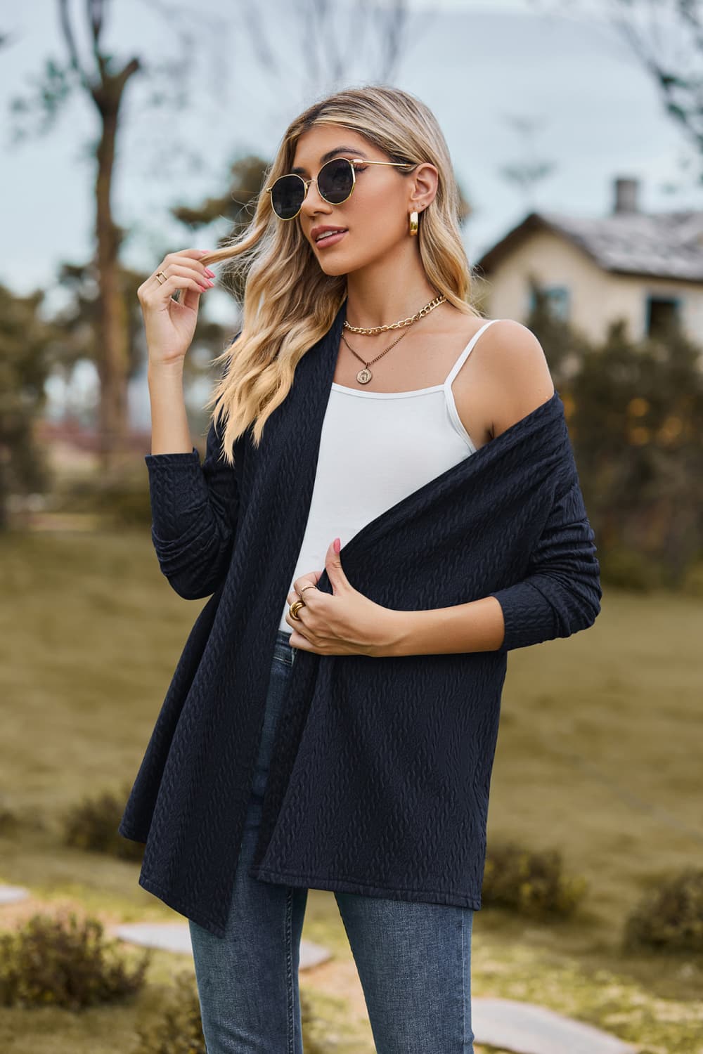 Dark Navy textured knit cardigan with drape front and long sleeves.