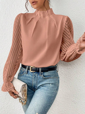 Chevron sleeve ruffle neck blouse in burnt coral with sheer chevron patterned sleeves