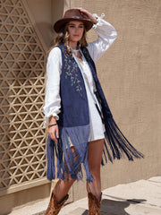 Navy faux suede vest with embroidered branches and long fringe detail.