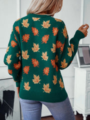 Green knit jumper with autumnal leaf motif, crew neck, long sleeves, ribbed hem and cuffs.
