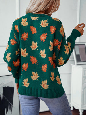 Green knit jumper with autumnal leaf motif, crew neck, long sleeves, ribbed hem and cuffs.