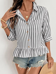 Striped button-down shirt with 3/4 sleeves and ruffle hem, styled with denim shorts.
