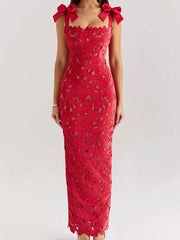 Red floral lace maxi dress with tie shoulder bows and cutout details.