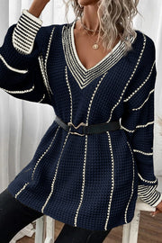 Dark navy knit oversized v-neck dress with white stripe details and black belt.