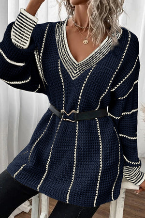 Dark navy knit oversized v-neck dress with white stripe details and black belt.