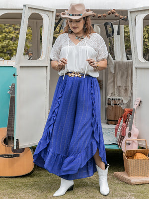 Azure ruffle overlay palazzo trousers in royal blue with gold pinstripes and polka dots.