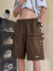 Brown cargo shorts with drawstring and double strap pocket details.