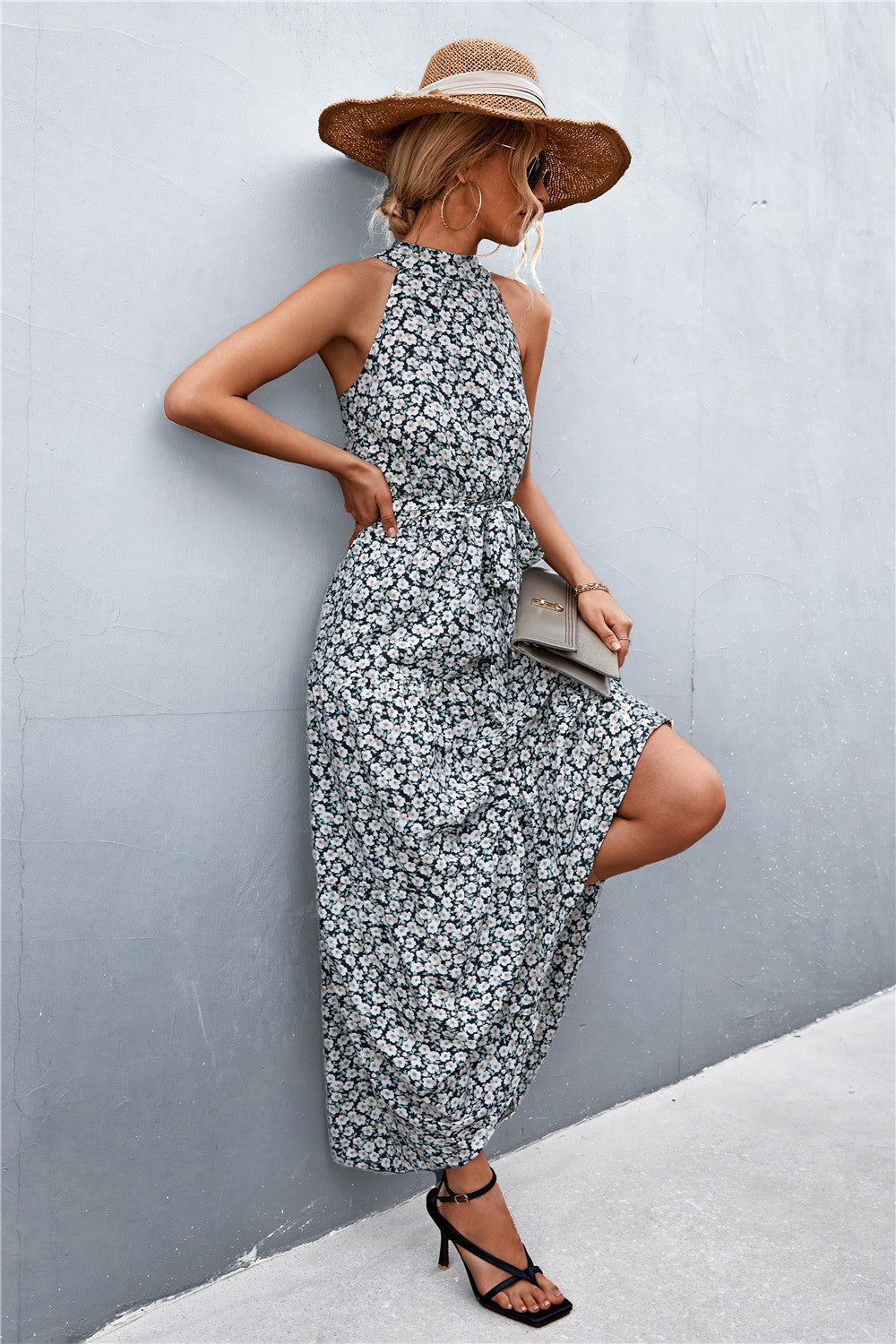 Black floral print maxi dress with halter neckline and tie waist.