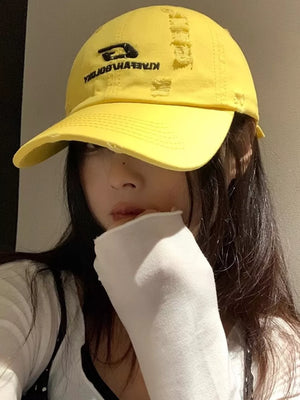 Yellow distressed cotton baseball hat with embroidered logo