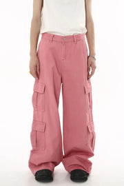 Oversized dusty pink cargo palazzo pants with multiple flap pockets and button front.