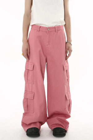 Oversized dusty pink cargo palazzo pants with multiple flap pockets and button front.