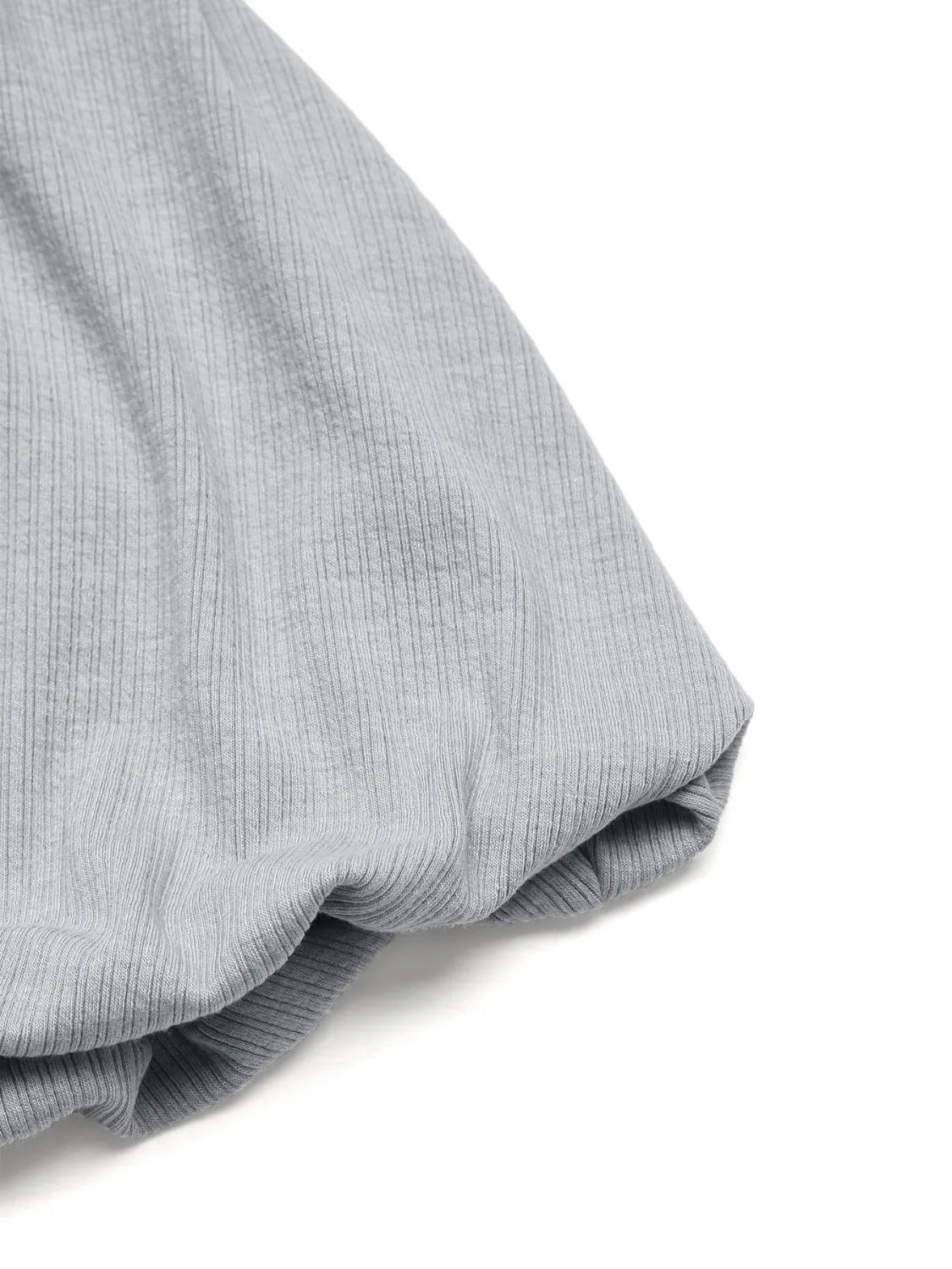 Gray ribbed cami detail showing fabric texture and a gathered sleeve cuff.