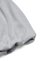 Gray ribbed cami detail showing fabric texture and a gathered sleeve cuff.