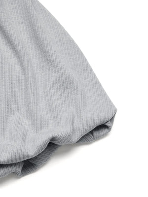 Gray ribbed cami detail showing fabric texture and a gathered sleeve cuff.