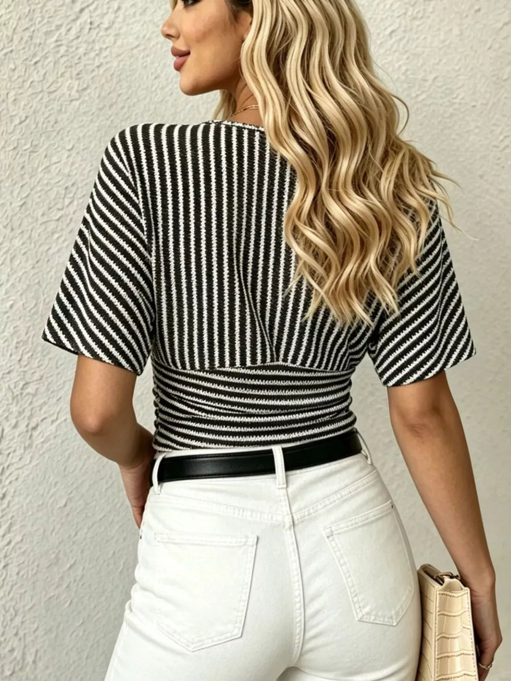 Black and white striped t-shirt with batwing sleeves and smocked waist detail