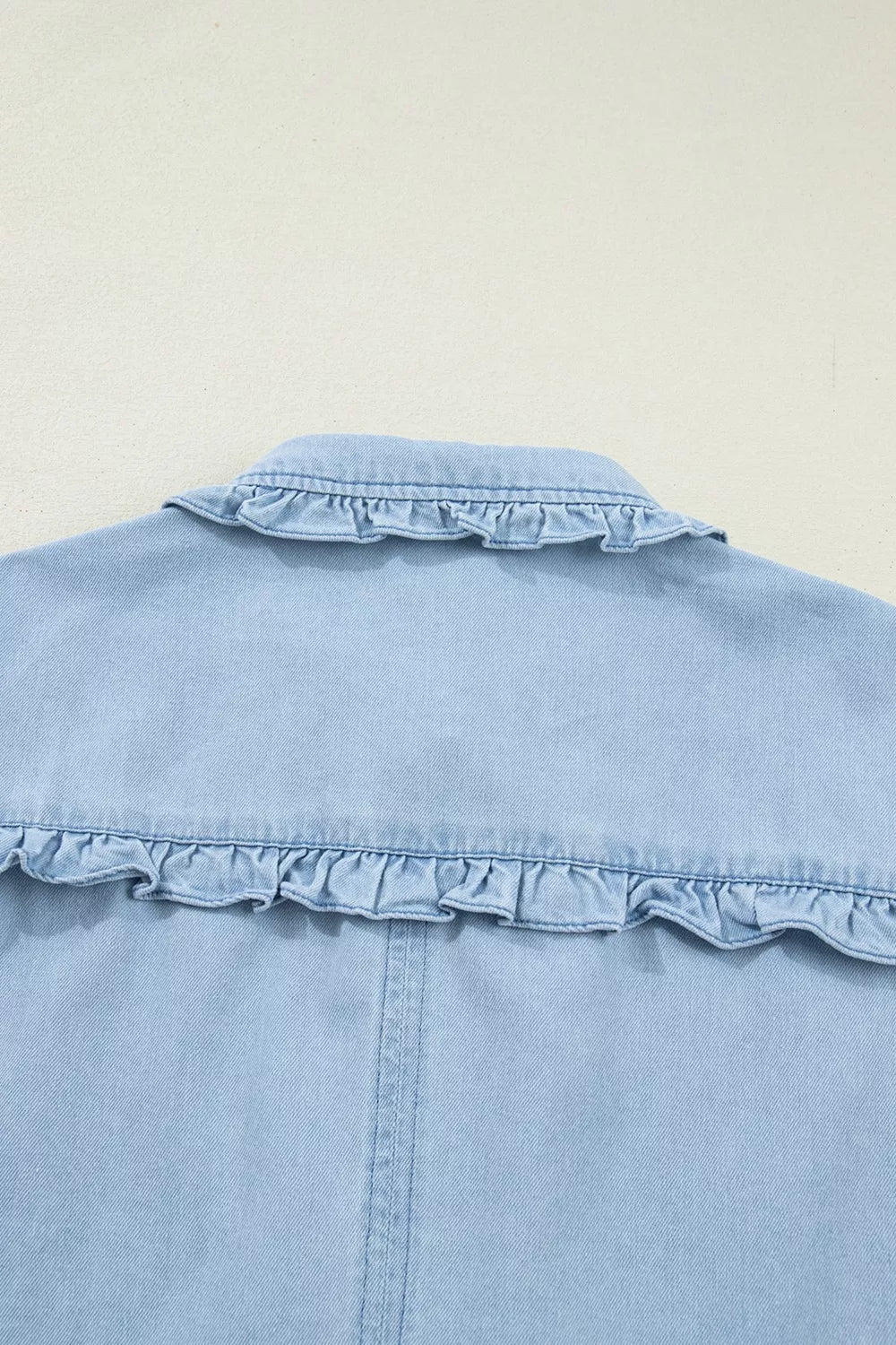Light blue denim shift dress with ruffled collar detail