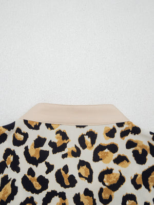 Print button-down shirt with leopard pattern and beige collar detail.