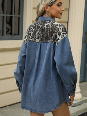 Denim trucker jacket in dusty blue with leopard print yoke and button front.