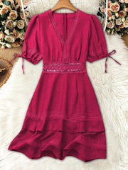 Rose red lace-embellished V-neck mini dress with tie sleeves and tiered hem.
