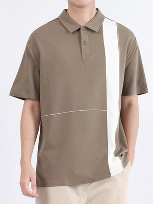 Men's camel polo shirt with white color block detail and subtle horizontal stitching.