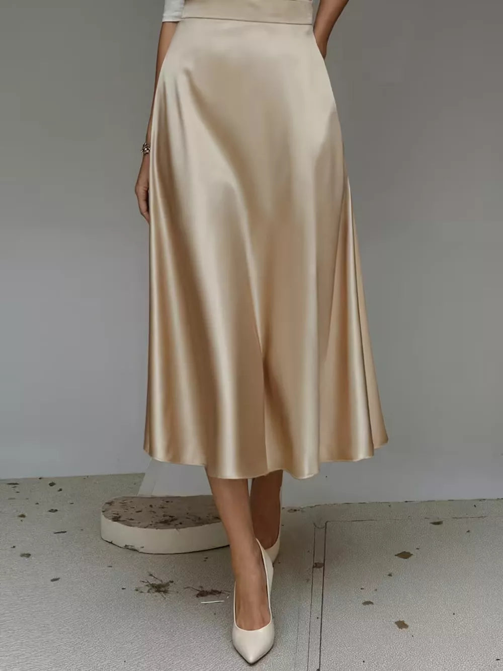 Khaki A-line satin midi skirt with pockets, flowing and elegant.