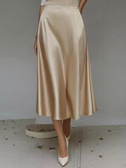 Khaki A-line satin midi skirt with pockets, flowing and elegant.