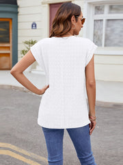 White cap-sleeve tee with subtle knit texture and relaxed fit.