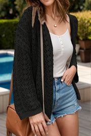 Black open-knit crochet cardigan with long sleeves and a relaxed fit.