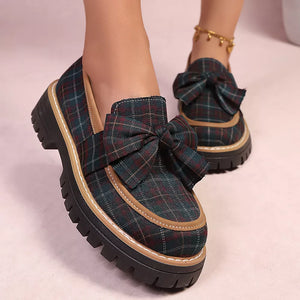 Plaid chunky loafers with bow accent and lug sole.