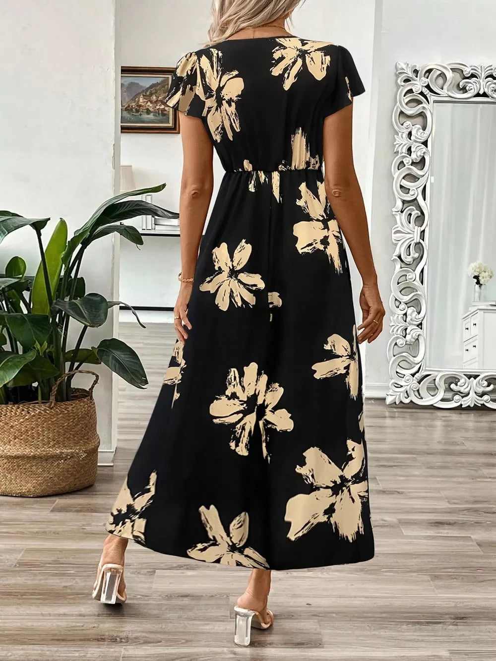 Black floral print midi dress with cap sleeves and a-line skirt.