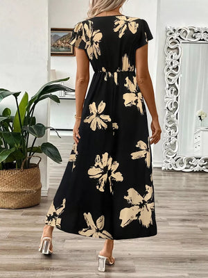 Black floral print midi dress with cap sleeves and a-line skirt.