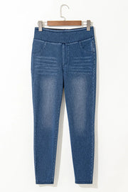 Denim-effect leggings in medium wash with a sculpted high rise and faux pockets.