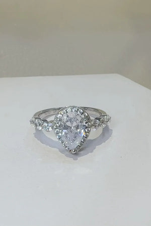 Silver pear-cut halo moissanite ring with accent stones