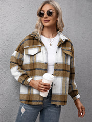 Camel plaid oversized button-up shirt with white and blue accents, worn open over a white top.