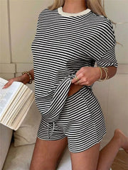 Black and white striped two-piece set with drawstring shorts and crew neck top.