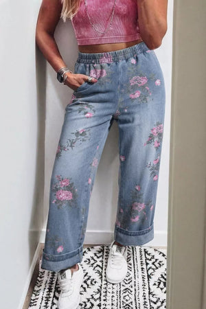 Floral wide-leg jeans with elastic waistband and pink floral print.