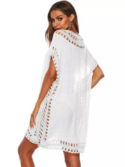 White crochet V-neck cover-up dress with cutout details and short sleeves.