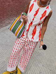 Red fish print sleeveless top and pants set with gold button details.