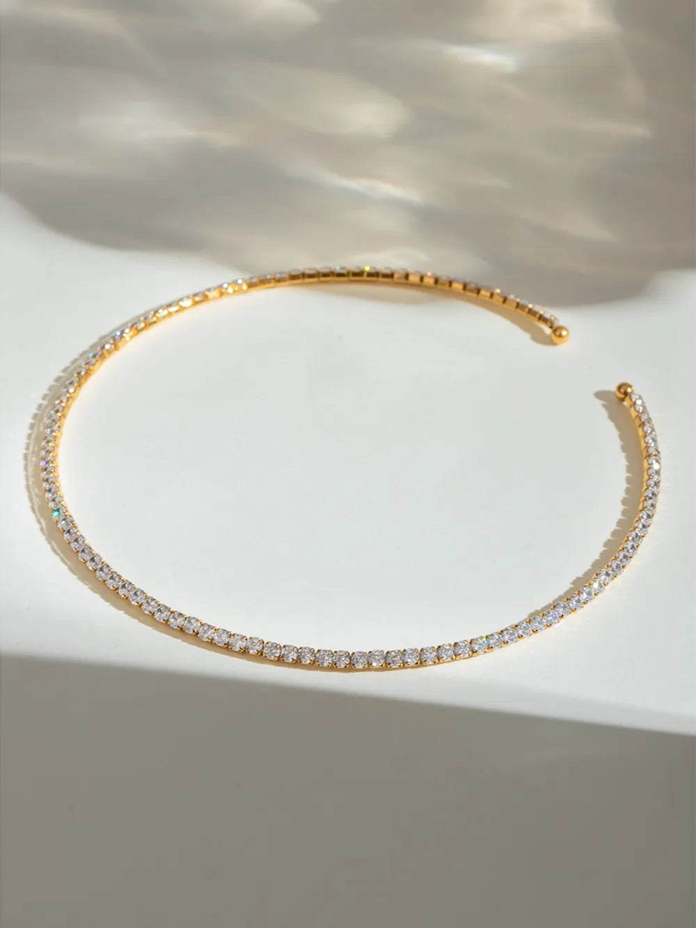 Gold collar necklace with a full row of diamonds